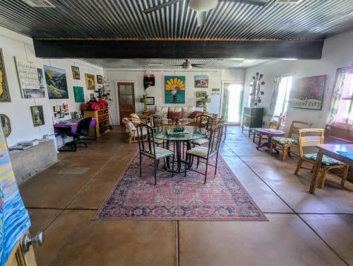 a dining room with a table and chairs at Pelican Spa in Truth or Consequences