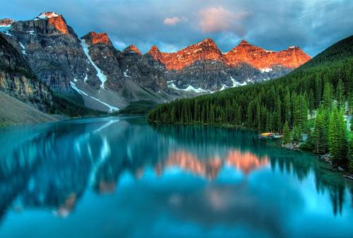 a view of a lake with mountains in the background at Rundle Lux Villa at Timberstone in Canmore