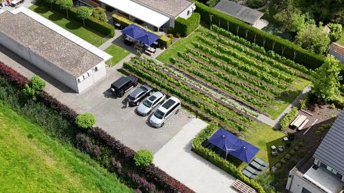 an overhead view of a garden with cars parked in a parking lot at Abalona Hotel & Apartments in Dendermonde