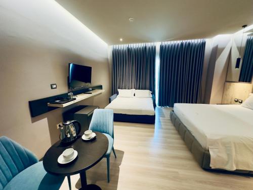 Postel nebo postele na pokoji v ubytování Hotel Olive