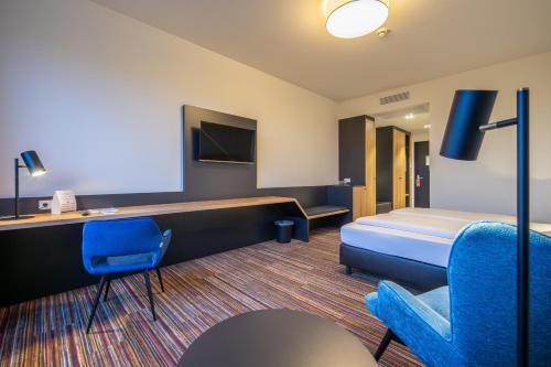 TV a/nebo společenská místnost v ubytování N+S City Hotel Neumarkt