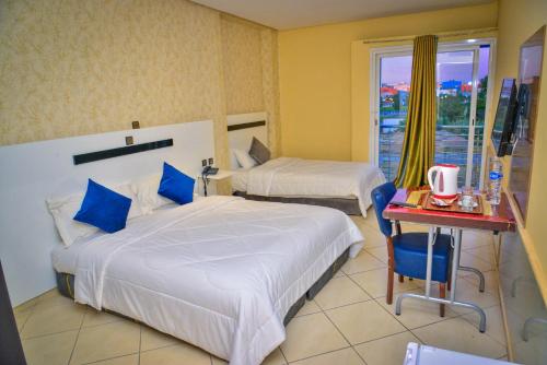 Postel nebo postele na pokoji v ubytování Free Zone Hotel