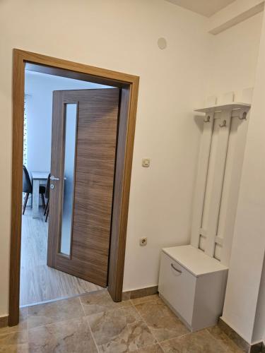 a bathroom with a toilet and a door at Villa Stedar in Ohrid