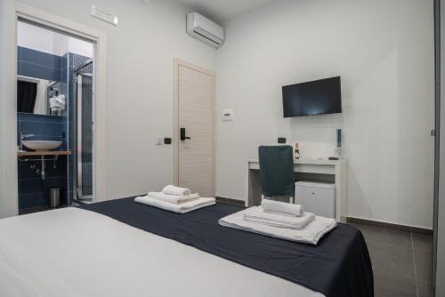 Posteľ alebo postele v izbe v ubytovaní Doria Suites Napoli