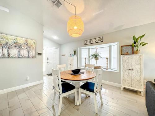 a dining room with a table and chairs at Sunshine Cove in Haines City