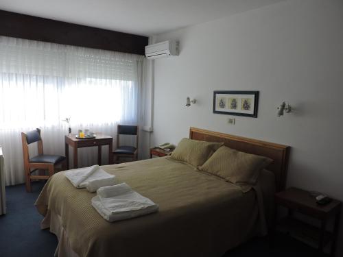 Cama o camas de una habitación en Hotel Centenario