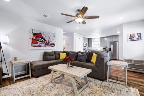 a living room with a couch and a table at The shoe LA-LA house in San Antonio