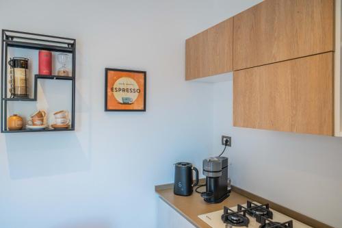 a kitchen with a counter with a coffee maker on it at La Terrazza di Porta Messina in Taormina