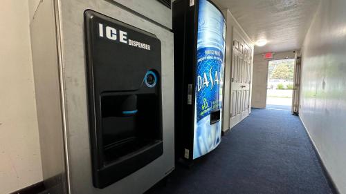 a hallway with an ice machine on the wall at USA Inn in Wells