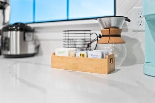 a kitchen counter with a wooden block with a blender at Luxe Desert Retreat - Near Grand Canyon South Rim in Valle