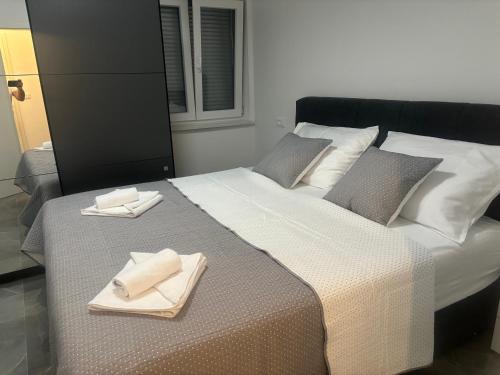 Postel nebo postele na pokoji v ubytování Apartman TINI 2