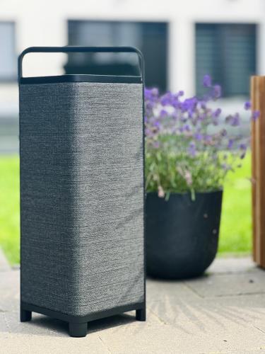 a speaker sitting next to a pot of flowers at Luxurious Escape - Room LoveSerenity with pool and jacuzzi in Brussels