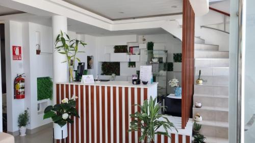 a lobby with a red and white striped counter at Hotel Atenas City in San Andrés
