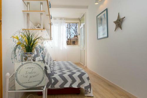 a hallway with a zebra print bed in a room at Lux apartment Draga with balkony in Split
