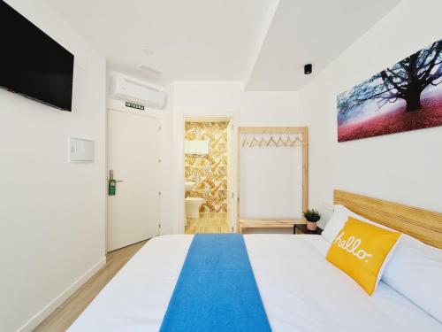 Ένα ή περισσότερα κρεβάτια σε δωμάτιο στο Bilbao ROOMS Miribilla