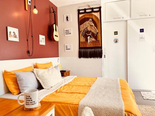 Postel nebo postele na pokoji v ubytování La Casita Bem Gaúcha com garagem