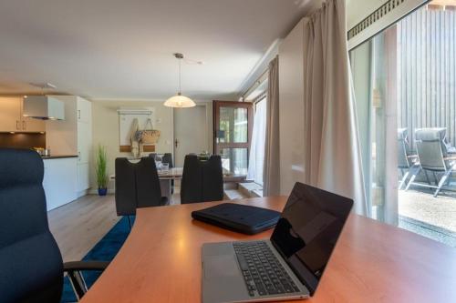 Μια τηλεόραση ή/και κέντρο ψυχαγωγίας στο Haus-Schwanensee-Wohnung-5
