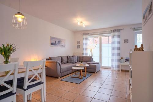 Posezení v ubytování Ferienwohnung Ankerplatz Dornumersiel