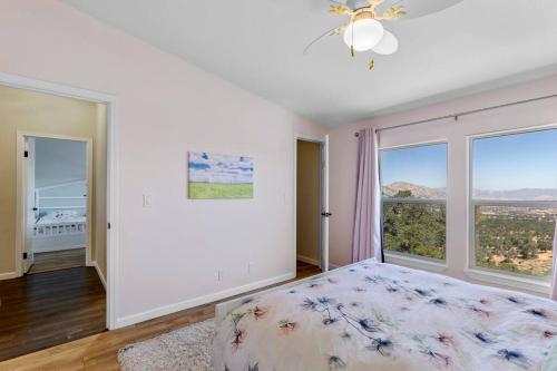 a bedroom with a bed and a large window at Five Points House with Amazing Views in Tehachapi