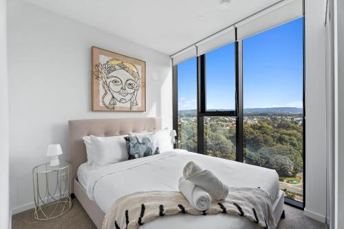 Ένα ή περισσότερα κρεβάτια σε δωμάτιο στο The Gallery - Q Stay