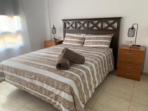 Postel nebo postele na pokoji v ubytování Arcoiris Paradise A 300 metros de la playa ,piscina y parque infantil