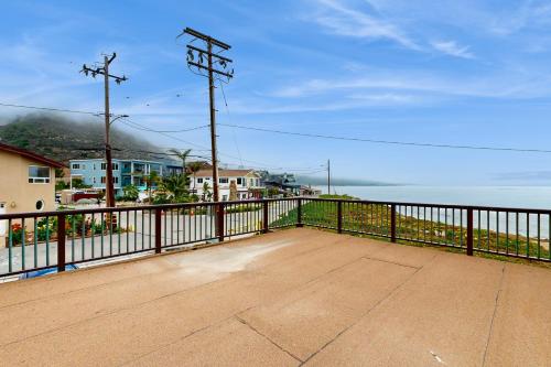 a view of the ocean from the balcony of a house at Brink of Paradise in Carpinteria