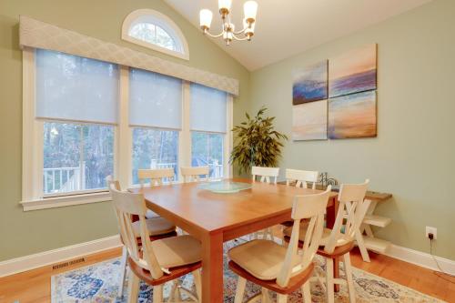 a dining room with a wooden table and chairs at 6 Mi to Bethany Beach Family Home with BBQ and Yard in Ocean View