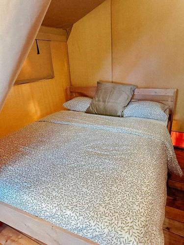 a large bed in a room with at Camping Miramar Playa - tienda familiar in Torredembarra