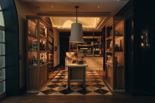 a kitchen with a counter and a checkerboard floor at Four Seasons Hotel Mexico City in Mexico City