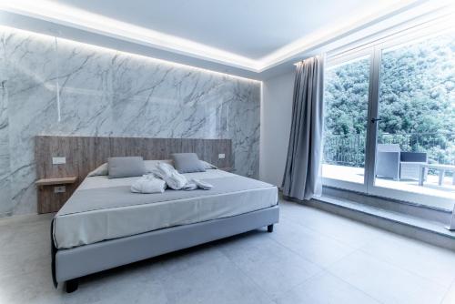 Ένα ή περισσότερα κρεβάτια σε δωμάτιο στο Hotel Lago Bin