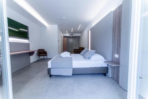 Ένα ή περισσότερα κρεβάτια σε δωμάτιο στο Hotel Lago Bin