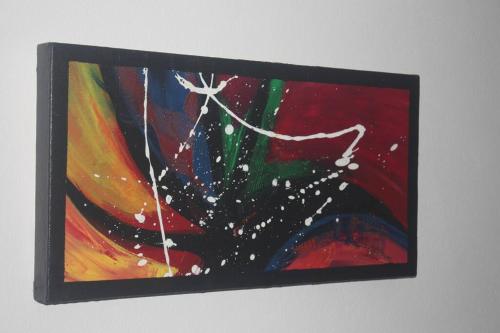 a painting of a flower on a wall at la kasaloc in Saint-Laurent du Maroni