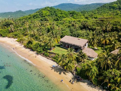 an aerial view of a resort on a beach at Arrecifes Refugio Natural in Santa Marta