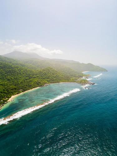 an aerial view of a beach in the ocean at Arrecifes Refugio Natural in Santa Marta