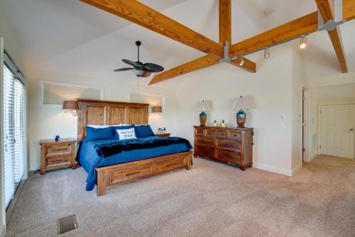 a bedroom with a wooden bed and a wooden dresser at Luxe Spring Hill Home with Patio and Dock! in Spring Hill
