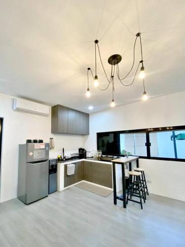a kitchen with a table and some chairs in it at Gray cozy unit in Valencia