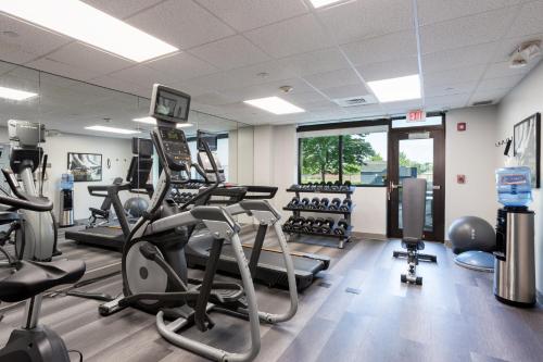 a gym with treadmills and elliptical machines at Staybridge Suites Buffalo by IHG in Buffalo
