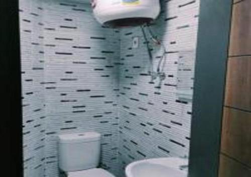 a bathroom with a toilet and a sink at Porto matrouh Magic sea in Marsa Matruh
