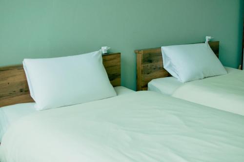 Ένα ή περισσότερα κρεβάτια σε δωμάτιο στο Hostel Mt. Fuji - FUKUYA