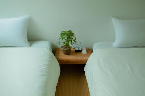 Ένα ή περισσότερα κρεβάτια σε δωμάτιο στο Hostel Mt. Fuji - FUKUYA