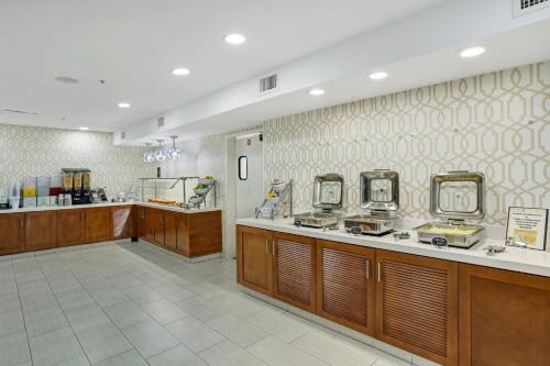a restaurant with a counter and a food court at Staybridge Suites Columbia - Baltimore by IHG in Columbia