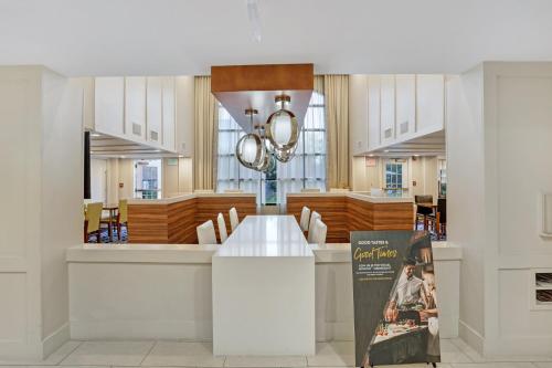 a dining room with a table and chairs at Staybridge Suites Columbia - Baltimore by IHG in Columbia
