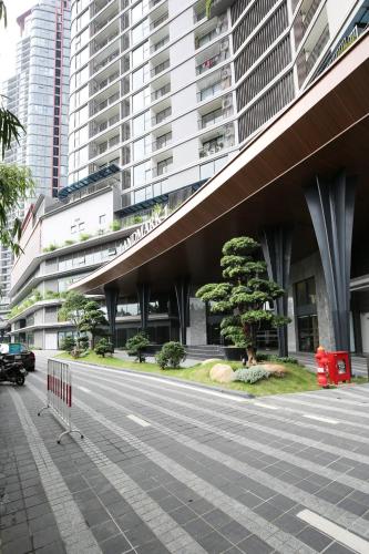 a street in front of a large building at 3Br Ecopark apt Onsen! Balcony lake view Free Pool in HÆ°ng YÃªn