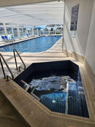a large swimming pool in a building with a swimming pool at 19th Avenue on the Beach in Gold Coast