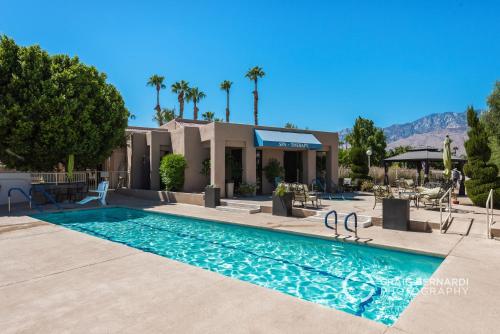 a swimming pool in front of a house at Desert Country Club Paradise! in Cathedral City