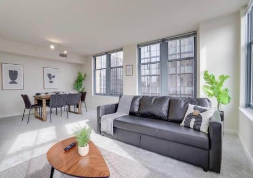 a living room with a couch and a table at Splendid 2 BR Condo At Pentagon City in Arlington