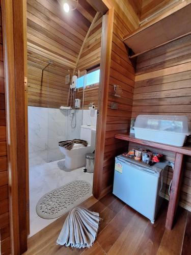 a bathroom with a shower and a toilet and a sink at Plaiphu Pool Villas in Phangnga