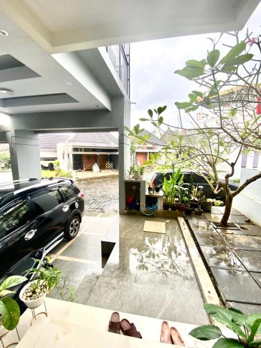 a view of a parking lot with a car parked at Villa Plumeria A3 in Jember