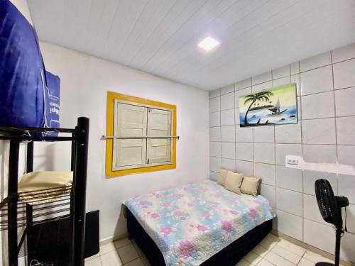 En eller flere senge i et værelse på Casa em Itamaracá