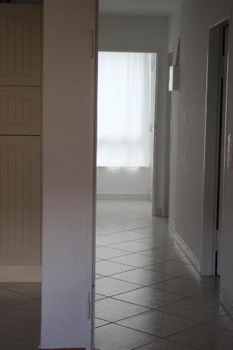 an empty hallway with a door and a window at Sonnenschein in Baden-Baden